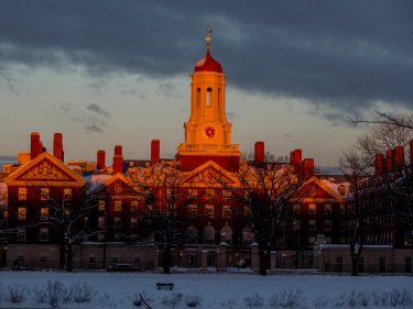 A harvard building during sunset