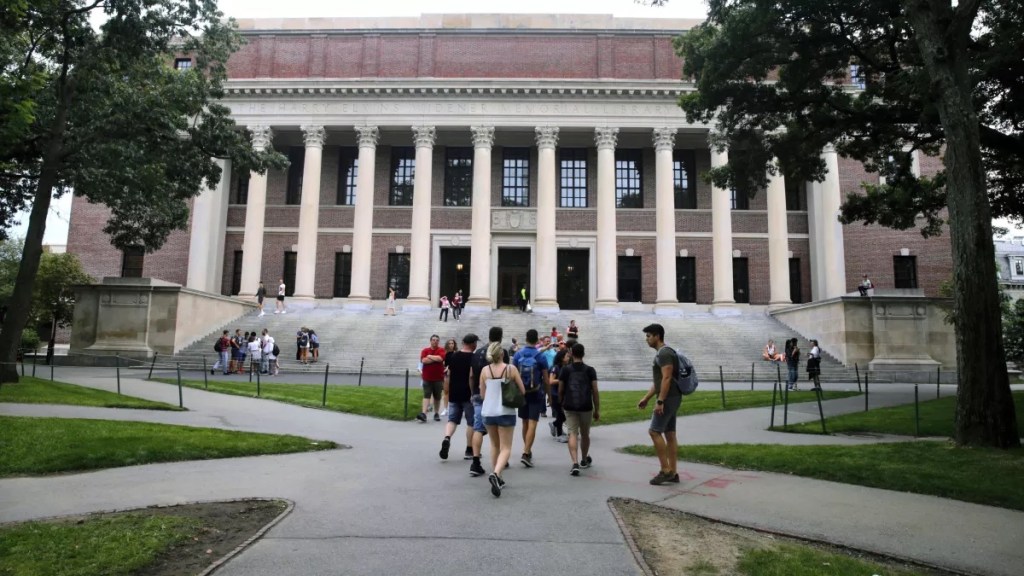 Students walk on the Harvard University campus in 2019.
