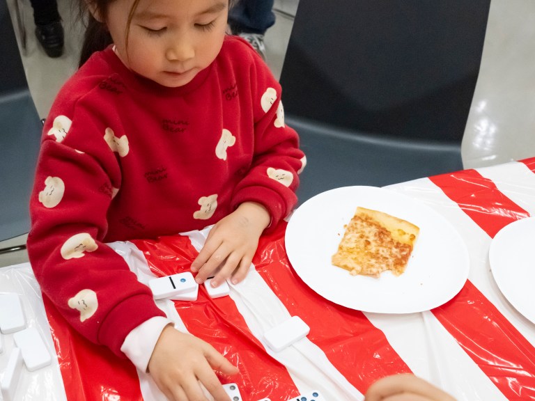 girl playing dominoes