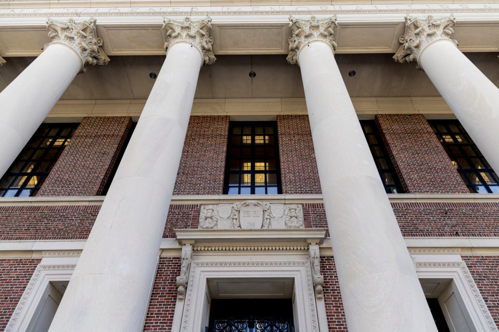 Large columns on a brick building.