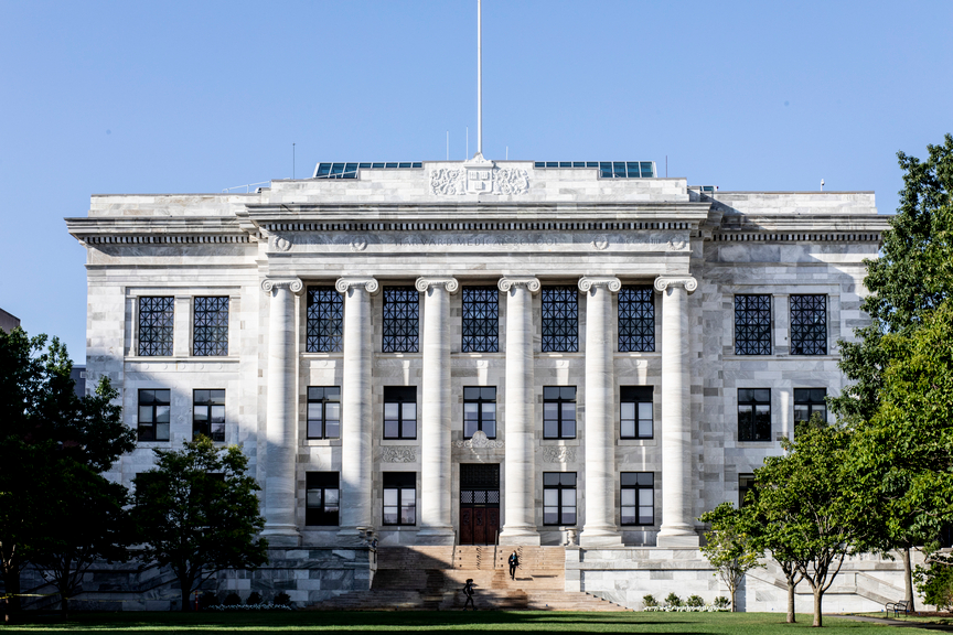 Gordon Hall against a bright blue sky.