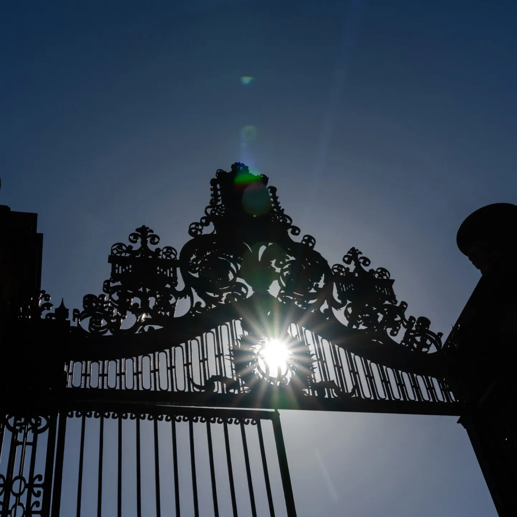 Harvard gate with the sun shining through