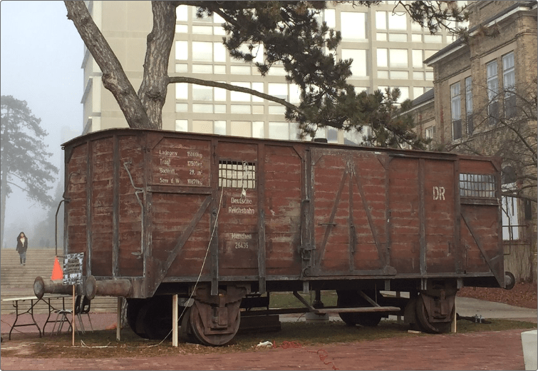a brown cattle car that transported millions of Jews to concentration camps during World War II.