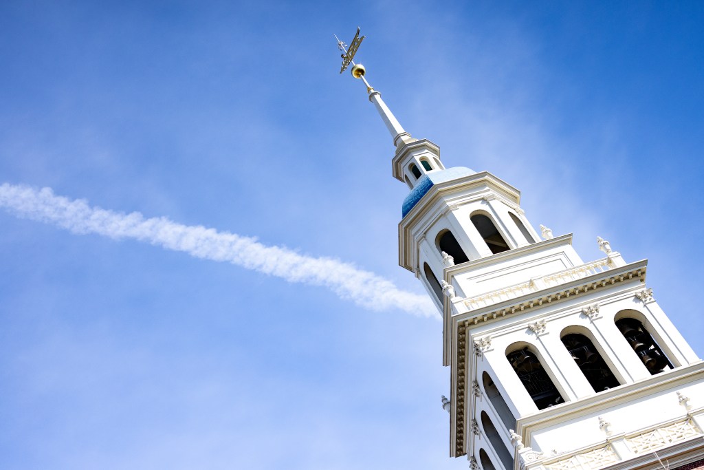 bell tower against a bright blue sky.