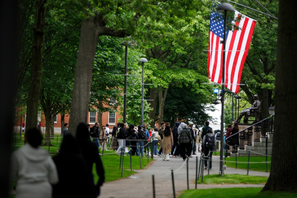 American flag and the John Harvard statue.