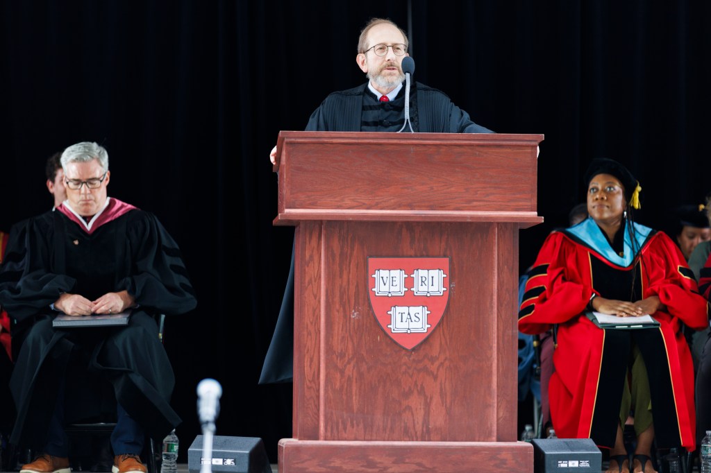 Alan Barber speaking at a podium.