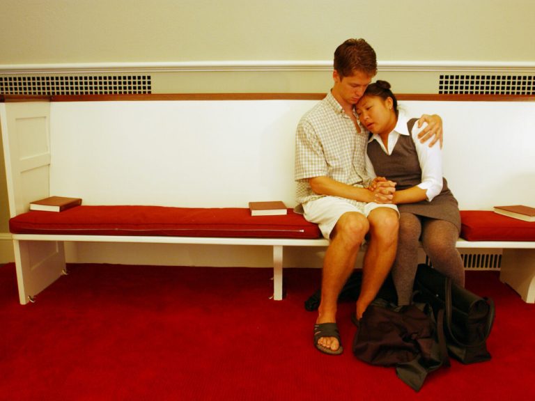 Two students consoling one another