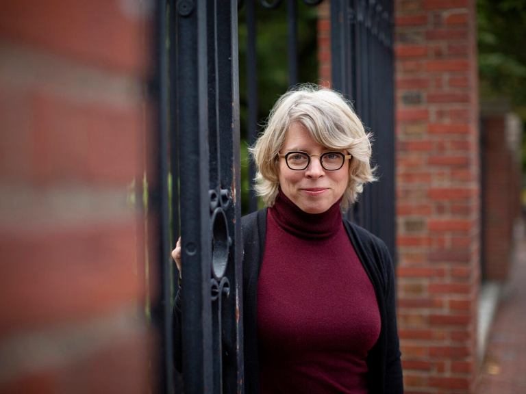 Jill Lepore near a gate