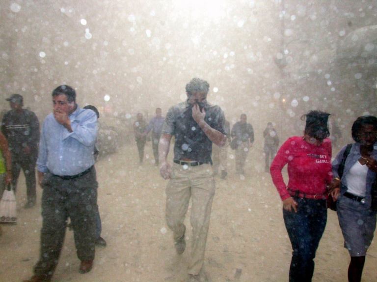 People running from ashes