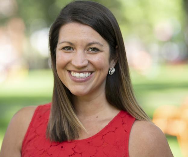 A woman stands outside