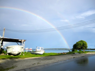 A rainbow shining over a beach