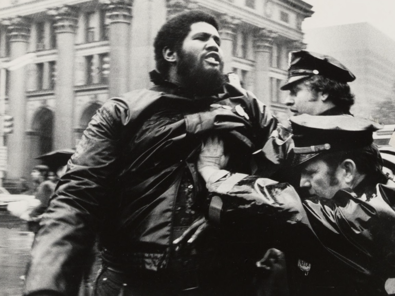 Police pushing an African American man