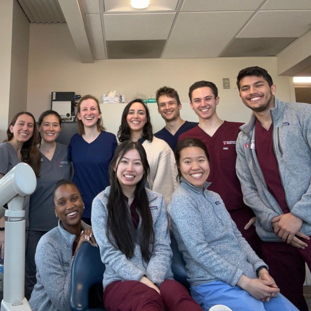 A group of dental students in a clinic