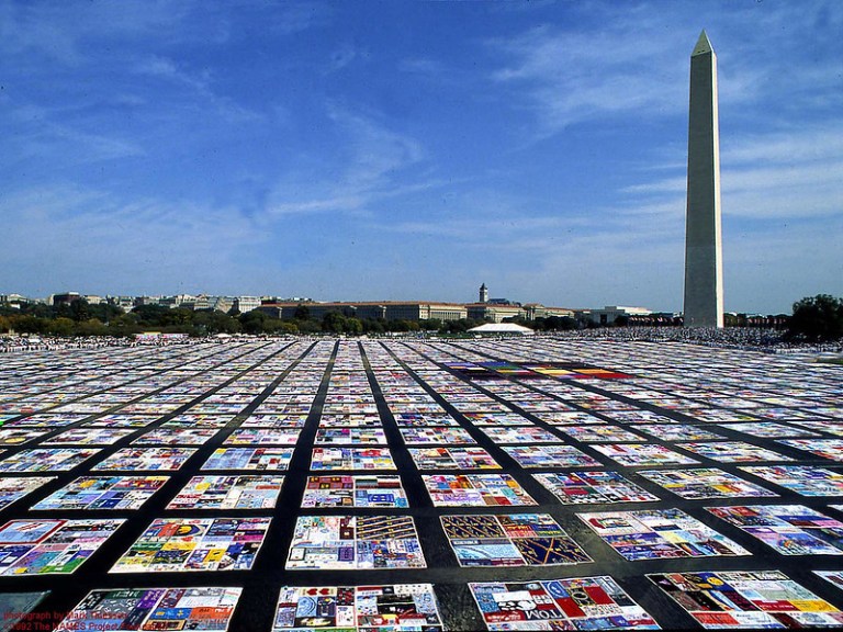 A large scale art installation at the Washington Monument with large quilt squares