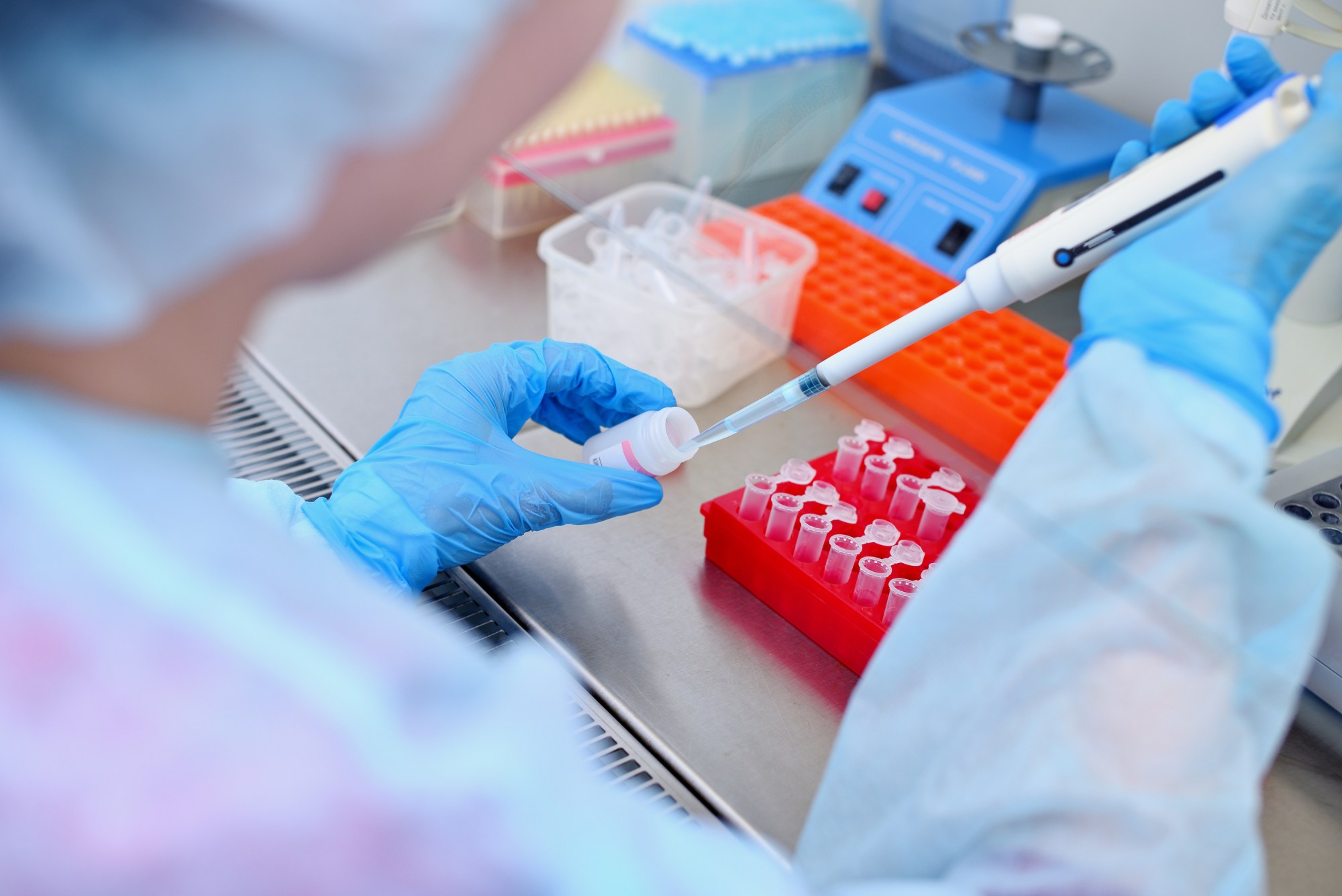 A lab technician tests a blood sample