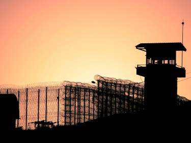 A prison wall seen at dusk