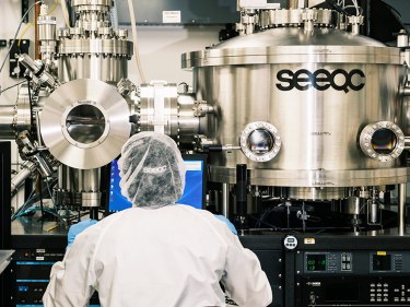 A person in front of a large tubed system