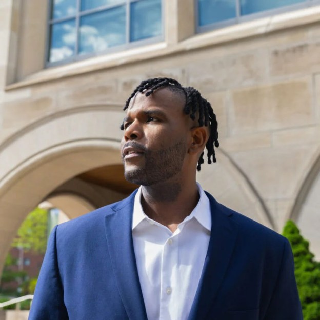 Law student Sean Wynn stands outside